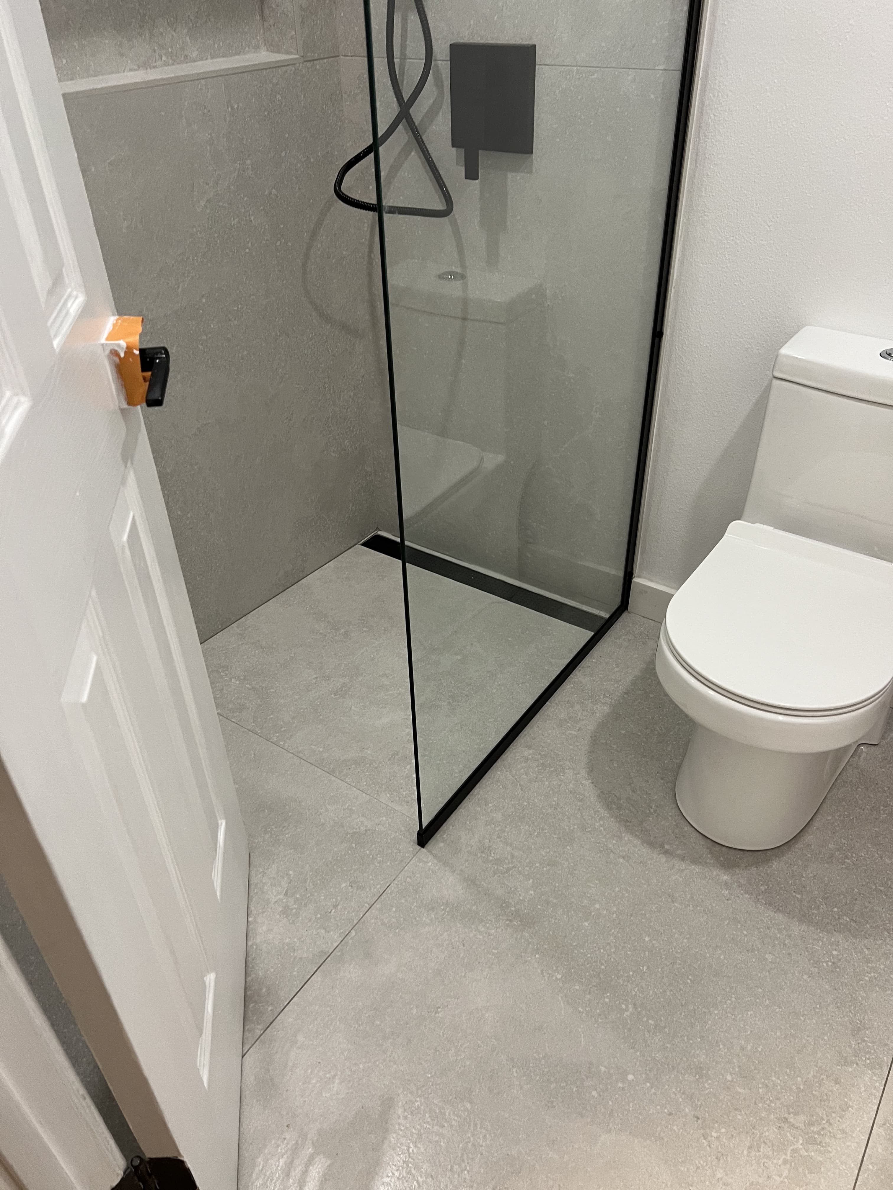 Modern bathroom with walk-in shower and tile flooring
